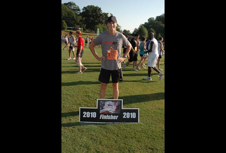 Dr. Pate posing with finisher sign