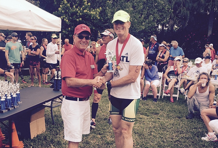 Dr. Pate shaking hands with someone after race