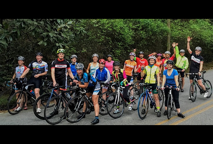 Dr. Pate and large group of cyclists