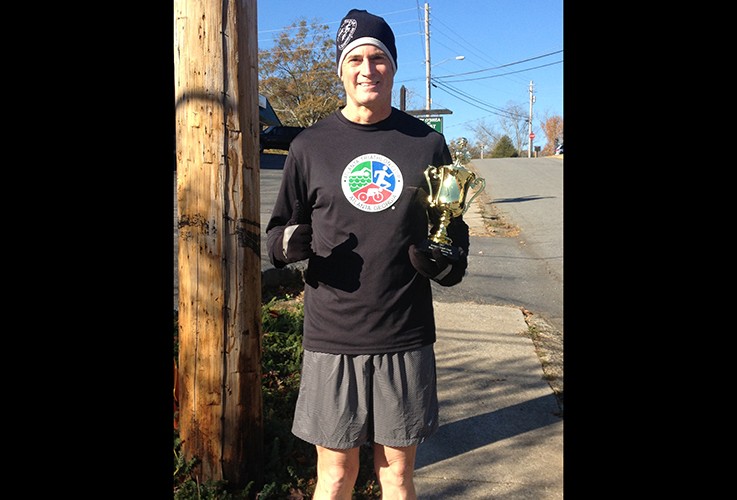 Dr. Pate holding a trophy