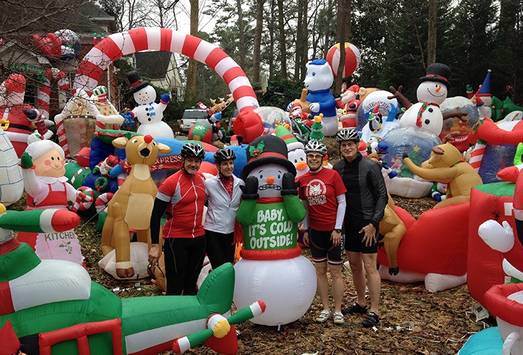 Dr. Pate and other racers posing with snowman mascot