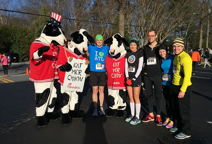 Dr. Pate and team members posing with Chick Fil'A cows