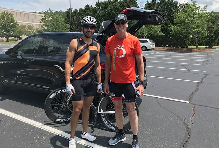 Dr. Pate and fellow racer posing together by car