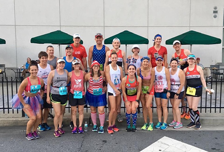 Dr. Pate posing with large group of racers