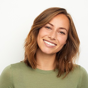 Woman smiling with a dental crown in Buckhead