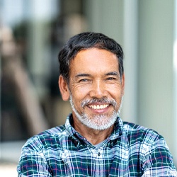 Man smiling with dental implants in Atlanta