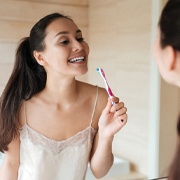 Woman brushing teeth