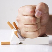 Man crushing cigarettes