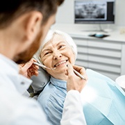 Implant dentist in Buckhead performing a dental exam