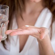 Lady prepares to take pill