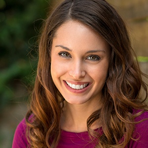 Woman smiling with a dental crown in Buckhead