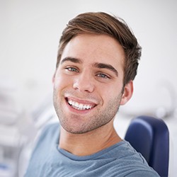 Smiling man in dental chair