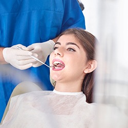 Woman receiving oral cancer screening