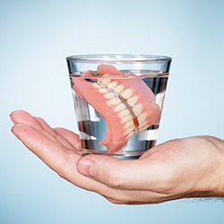 Dentures in glass of water