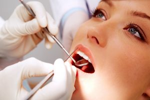 Woman having a dental cleaning.