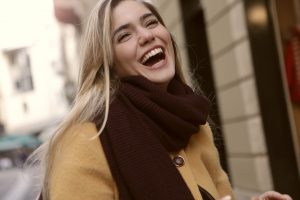 Laughing woman in winter clothing